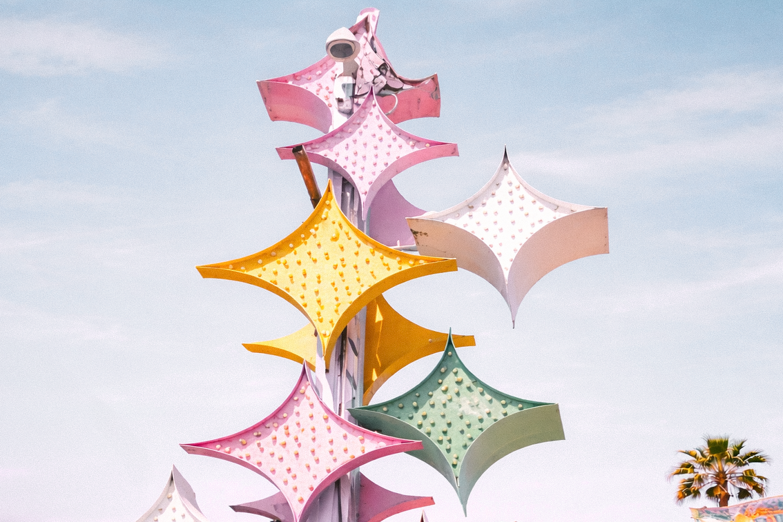 A close-up of a neon sign with multiple starbursts