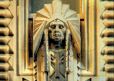 Zoomed in view of a statue on an Art Deco building