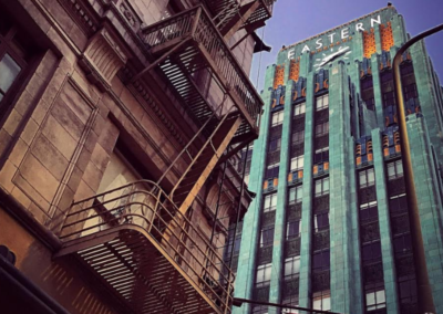 Upward view of a colorful Art Deco building