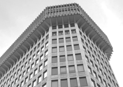 Detail of an overhanging portion of a Brutalist building
