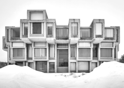 Cubic units on a Brutalist building in the snow