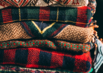 Stack of fall-patterned sweaters