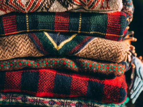 Stack of fall-patterned sweaters