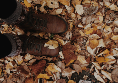 Boots on a bed of dried fall leaves