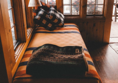 Small bed in a wood cabin