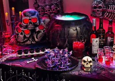 Halloween party spread with bubbling potion and other drinks