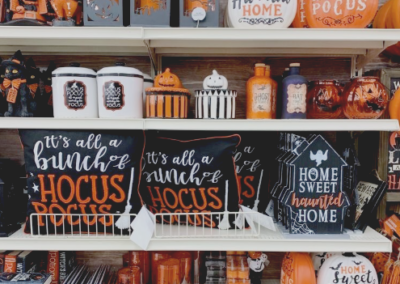 Black and orange Halloween decorations on shelves in a store
