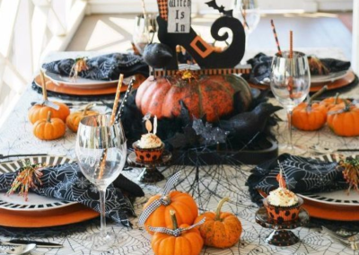 Black and orange Halloween decor on a dining table