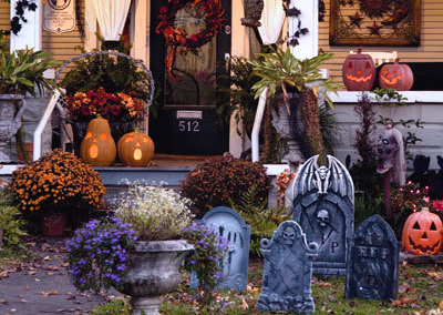 Kitschy Halloween grave decorations in a yard