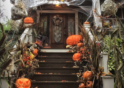 Halloween decorated steps leading to a house