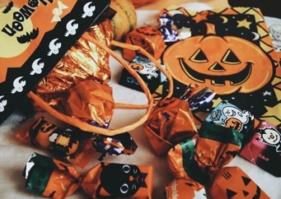 Halloween candy spilling out of a bag