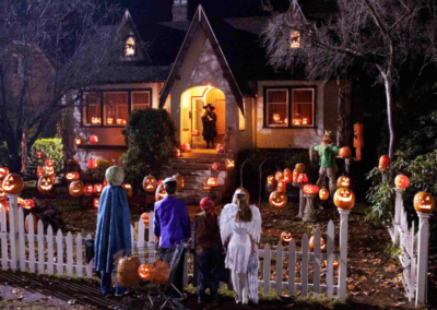 Kids in costume approaching a house to trick-or-treat