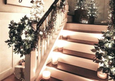 Candles lining a decorated staircase